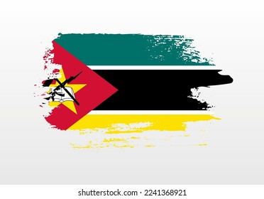 Modern style brush painted splash flag of Mozambique with solid background