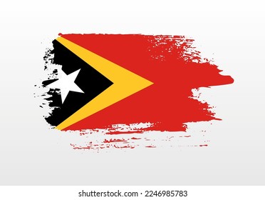 Modern style brush painted splash flag of Timor Leste with solid background