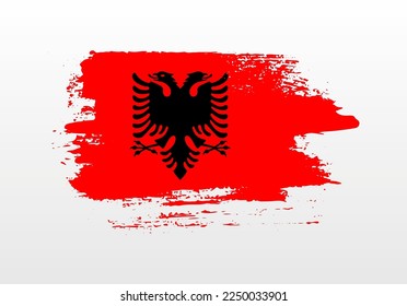 Modern style brush painted splash flag of Albania with solid background