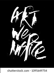 Modern Style Calligraphy Inscription Art We Inspire. Handpainted by Colapen and Drawing Pen Equipment. White Typography Concept on Black Blackboard. White Chalk for Restaurant Interior Prints Design