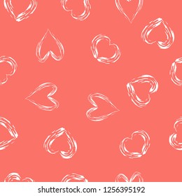 Modern style seamless vector background with hearts in Living Coral color.