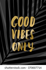 Modern and stylish typographic design poster. Hand lettered gold foil text "Good Vibes Only" on a background of palm leaves.