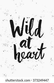 Modern and stylish typographic design poster. Hand lettered text "Wild at Heart" in black on white background.