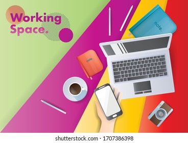 Modern and stylish Workplace. Top view of a notebook, coffee, camera, and laptop.