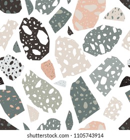 Modern terrazzo texture. Seamless pattern with colored stone fractions or pieces scattered on white background. Creative vector illustration for fabric print, wrapping paper, wallpaper, flooring.