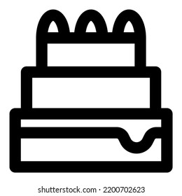 Modern three tiered cake with toppings and decor.