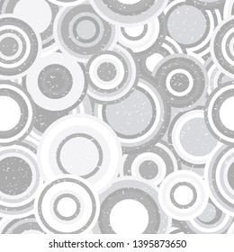 Modern vector abstract seamless geometric pattern with  circles in retro scandinavian style. Neutral gray and white colored shapes with worn out texture.