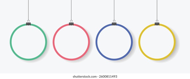 A modern vector illustration featuring four colorful circular frames hanging by clips. The green, red, blue, and yellow rings create a clean and minimalist design, perfect for infographics.