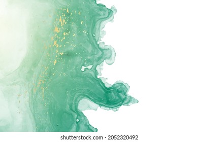 Modern watercolor background or elegant card design or wallpaper or poster with abstract green ink waves and golden splashes on a white.