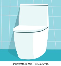 Modern white commode or toilet in a blue tile bathroom.