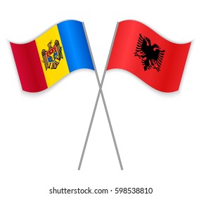 Moldovan and Albanian crossed flags. Moldova combined with Albania isolated on white. Language learning, international business or travel concept.