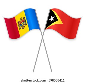 Moldovan and Timorese crossed flags. Moldova combined with East Timor isolated on white. Language learning, international business or travel concept.