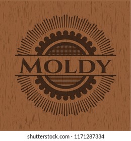 Moldy badge with wood background