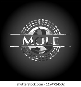 Mole on grey camouflaged pattern