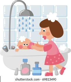 Mom bathing baby