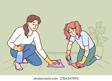 Mom and daughter are cleaning apartment together and washing floor using stain remover sprayer. Woman teaches child to do cleaning and household duties on own, taking care of girls future