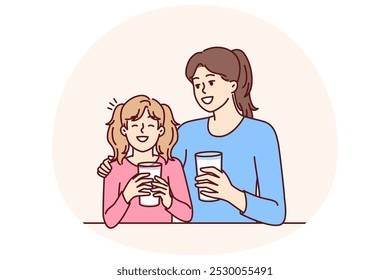 Mom and daughter drink natural milk to get useful vitamins and lactose or calcium from eco product. Woman hugging smiling teenage girl drinking milk to promote healthy food without chemicals