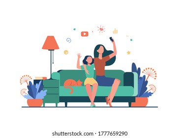 Mom and daughter leisure concept. Teen girl and her mother sitting on couch at home, using smartphone for video call or taking selfie. Can be used for family, mobile technology topics