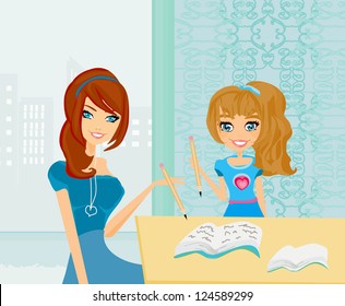 Mom helping her daughter with homework or schoolwork at home.