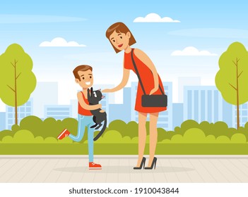 Mom and Her Son Walking with Cat in Urban Park, Boy Playing with Pet Animal Outdoors Cartoon Vector Illustration