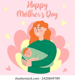 Mom holds the baby in her arms. Happy Mothers Day. Young woman with red hair shows care and love for the newborn baby.