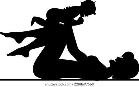 Mom lies and holds her little son in outstretched arms. They are happy and laughing. Silhouette.