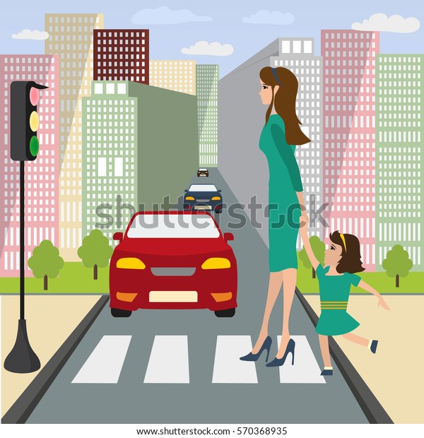 Mom with a little girl by the hand cross the road.
There is green light  on a traffic lights, There are cars are on
the streets in the city