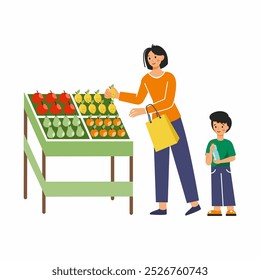 Mamãe e filho estão comprando frutas no supermercado. Mercearia na Europa.