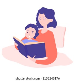 Mom And Son Get Ready For Bed At Night. In The Bed Read A Book. A Fairy Tale, A Magical Story That Had Interesting Dreams. Happy And Smiling Together.