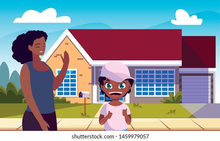 mom and son standing front home