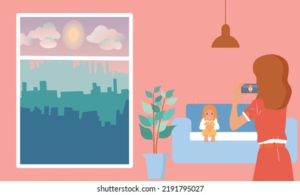 Mom takes a picture of her daughter in the room. Beautiful view of the city from the window.