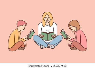 Mom and two children sit on floor with book and enthusiastically read interesting stories enjoying useful hobby. Woman with daughter and son read books with fiction together