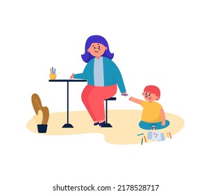 Mom works at home while her son sits and draws.