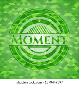 Moment green emblem. Mosaic background