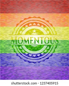 Momentous emblem on mosaic background with the colors of the LGBT flag