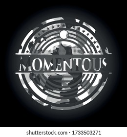 Momentous written on a grey camouflage texture 
