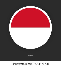Monaco circle flag with white border on dark grey background. Monaco button flag isolated on barely dark background.