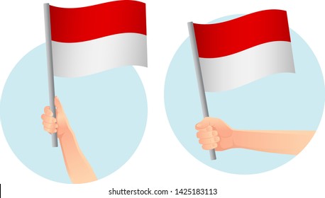 Monaco flag in hand. Patriotic background. National flag of Monaco vector illustration