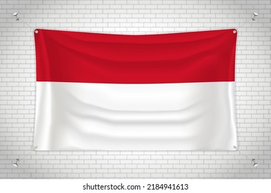 Monaco flag hanging on brick wall. 3D drawing. Flag attached to the wall. Neatly drawing in groups on separate layers for easy editing.