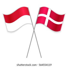 Monegasque and Danish crossed flags. Monaco combined with Denmark isolated on white. Language learning, international business or travel concept.