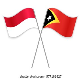 Monegasque and Timorese crossed flags. Monaco combined with East Timor isolated on white. Language learning, international business or travel concept.