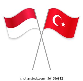 Monegasque and Turkish crossed flags. Monaco combined with Turkey isolated on white. Language learning, international business or travel concept.