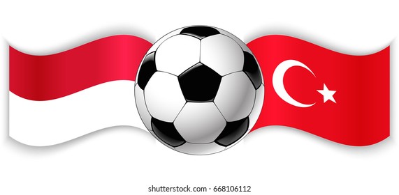 Monegasque and Turkish wavy flags with football ball. Monaco combined with Turkey isolated on white. Football match or international sport competition concept.