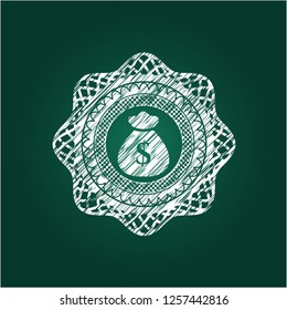 money bag icon inside chalk emblem written on a blackboard