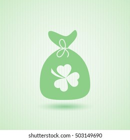 Money bag with three leaves clover sign.