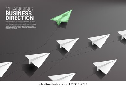 money banknote origami paper airplane going out from group of white. Business Concept of disruption and vision mission.