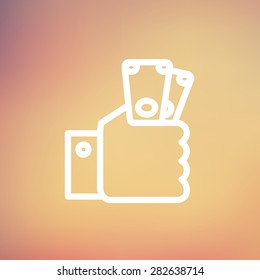 Money in hand icon thin line for web and mobile, modern minimalistic flat design. Vector white icon on gradient mesh background.