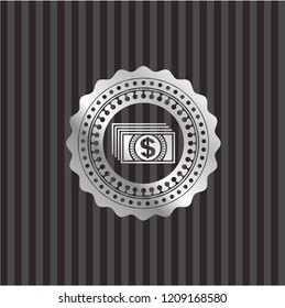 money icon inside silver badge or emblem