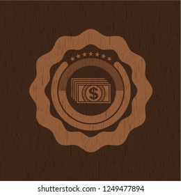 money icon inside wood badge or emblem