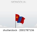 Mongolian flag flying on a pole standing tall under a white sky